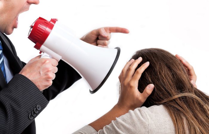 Boss With Megaphone Shouting At His Employee